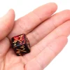 Dé modificateur positif noir et rouge +1 à +6