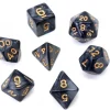 Set 7 dés multi-faces noirs nacrés chiffres or